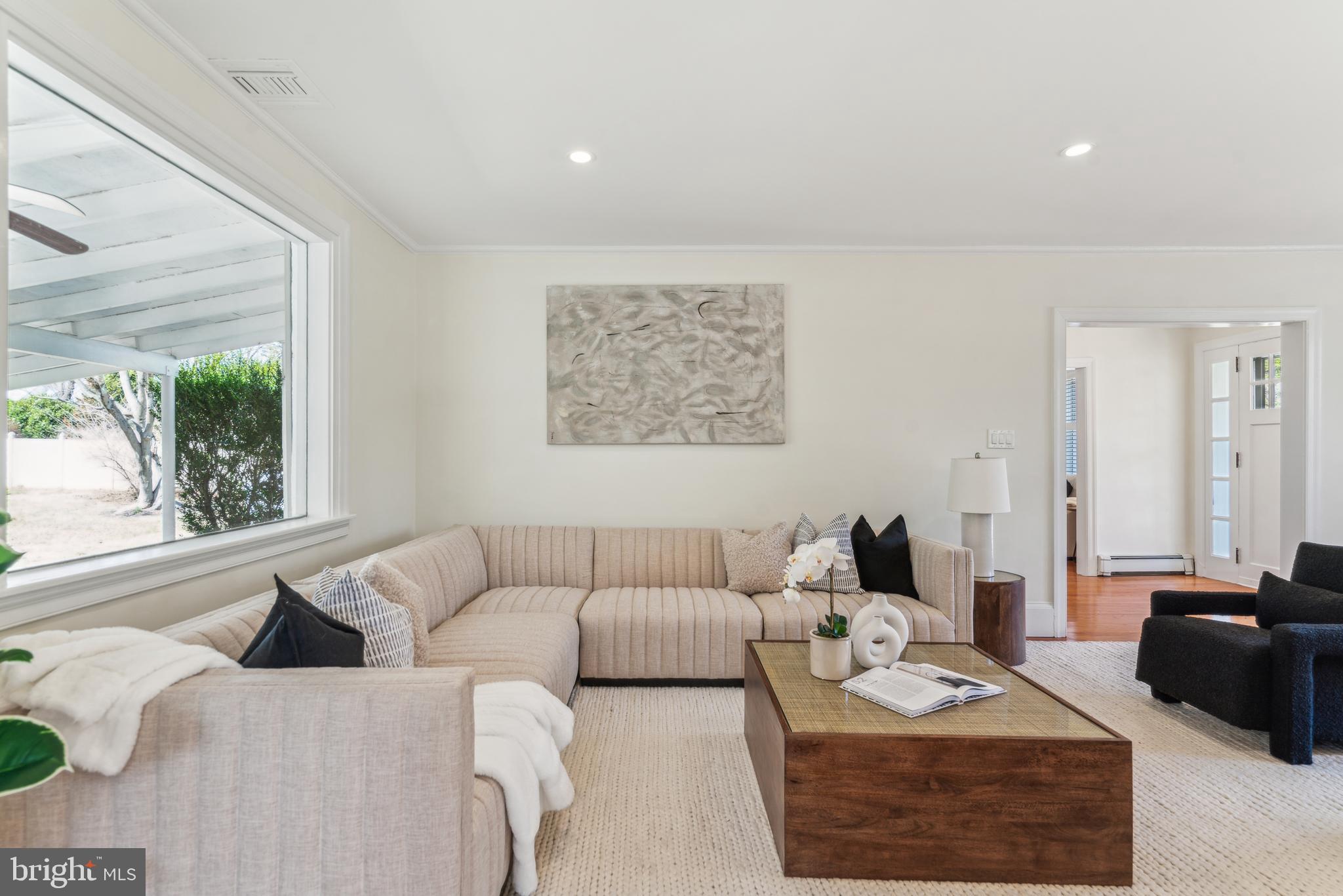 436 Penn Valley Road Penn Valley, PA 19072 - Photo 6 of 64 a living room with furniture wooden floor and a large window