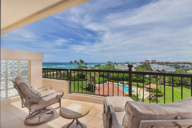 a view of a chairs and table in patio