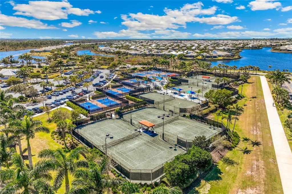 6931 Cay Court Naples, FL 34113 - Photo 17 of 24 Aerial view of residential area featuring a nearby body of water