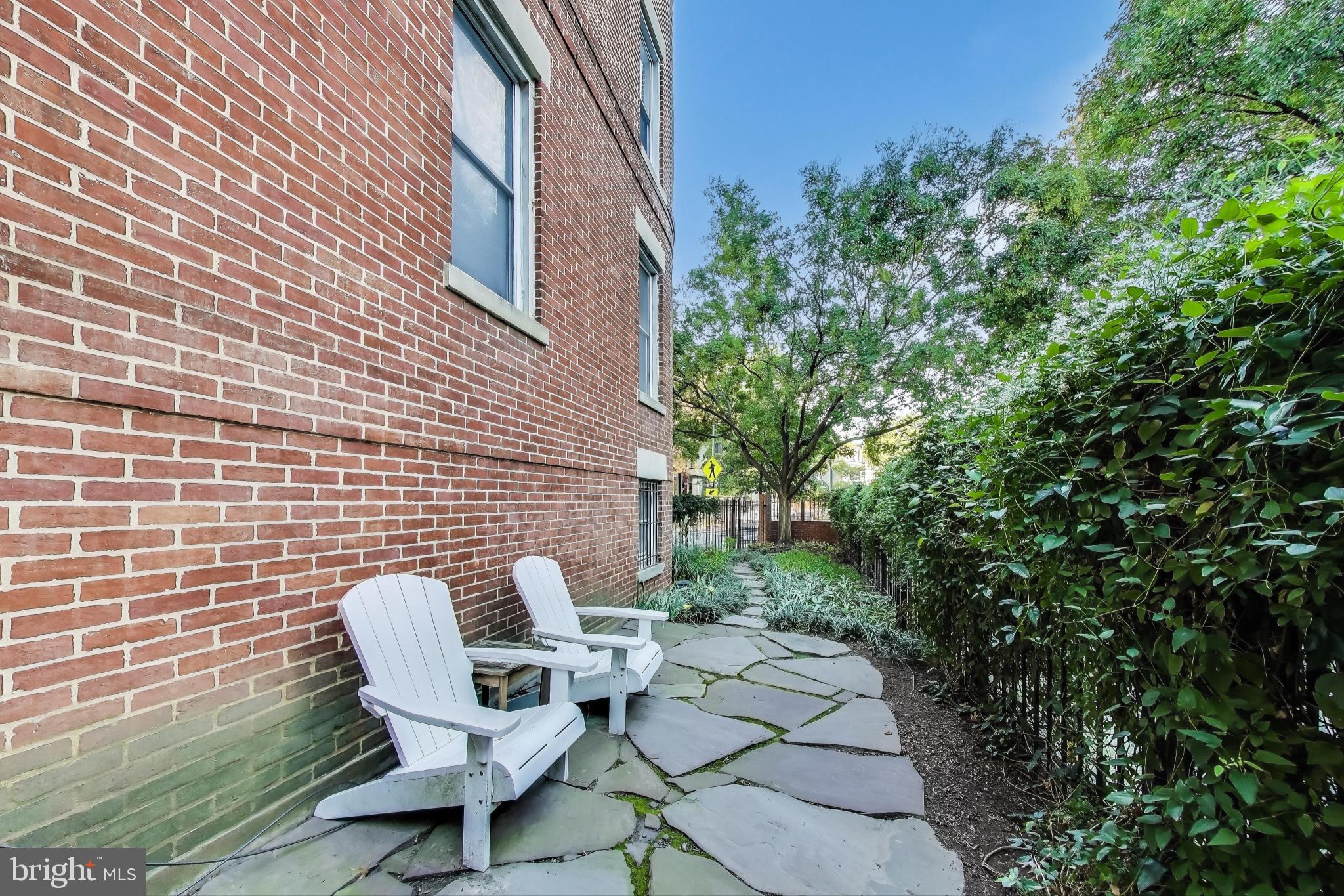 52 Quincy Place Northwest, Unit 304 Washington, DC 20001 - Photo 19 of 22 a view of a chairs in backyard of the house