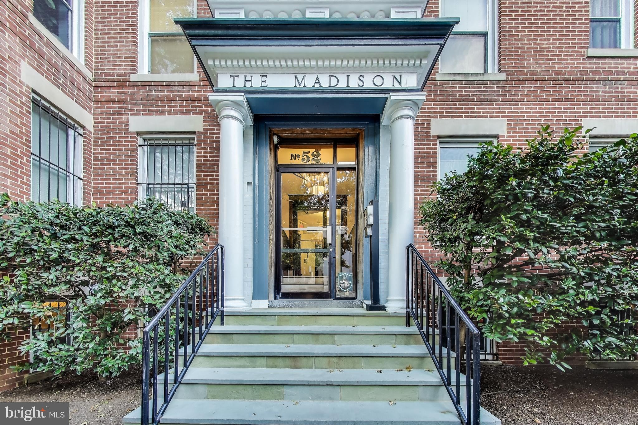 52 Quincy Place Northwest, Unit 304 Washington, DC 20001 - Photo 2 of 22 a front view of a house with a garden