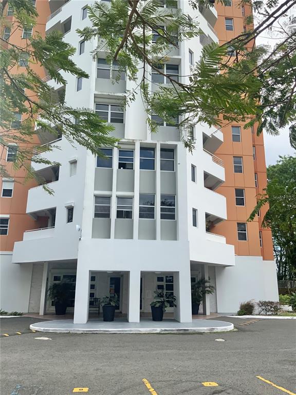 3011 View Point, Unit 1001 Guaynabo, PR 00969 - Photo 1 of 1 a front view of a building with a tree