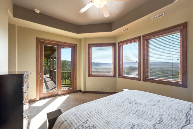 335 Bern Way Midway, UT 84049 - Photo 49 of 88 Room featuring wood-frame windows and glass-paneled doors, offering expansive landscape scenery