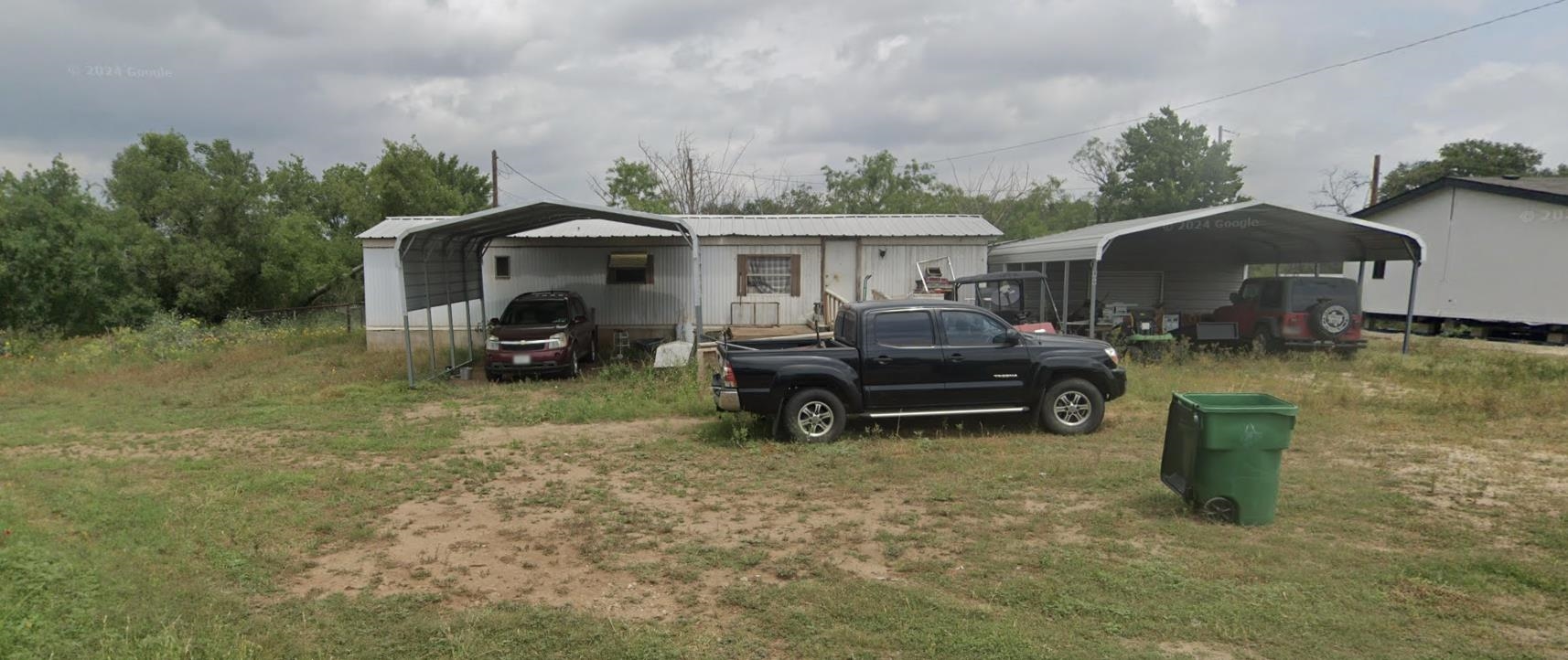 809 West Llano Street Llano, TX 78643 - Photo 2 of 12 a car parked in front of a house