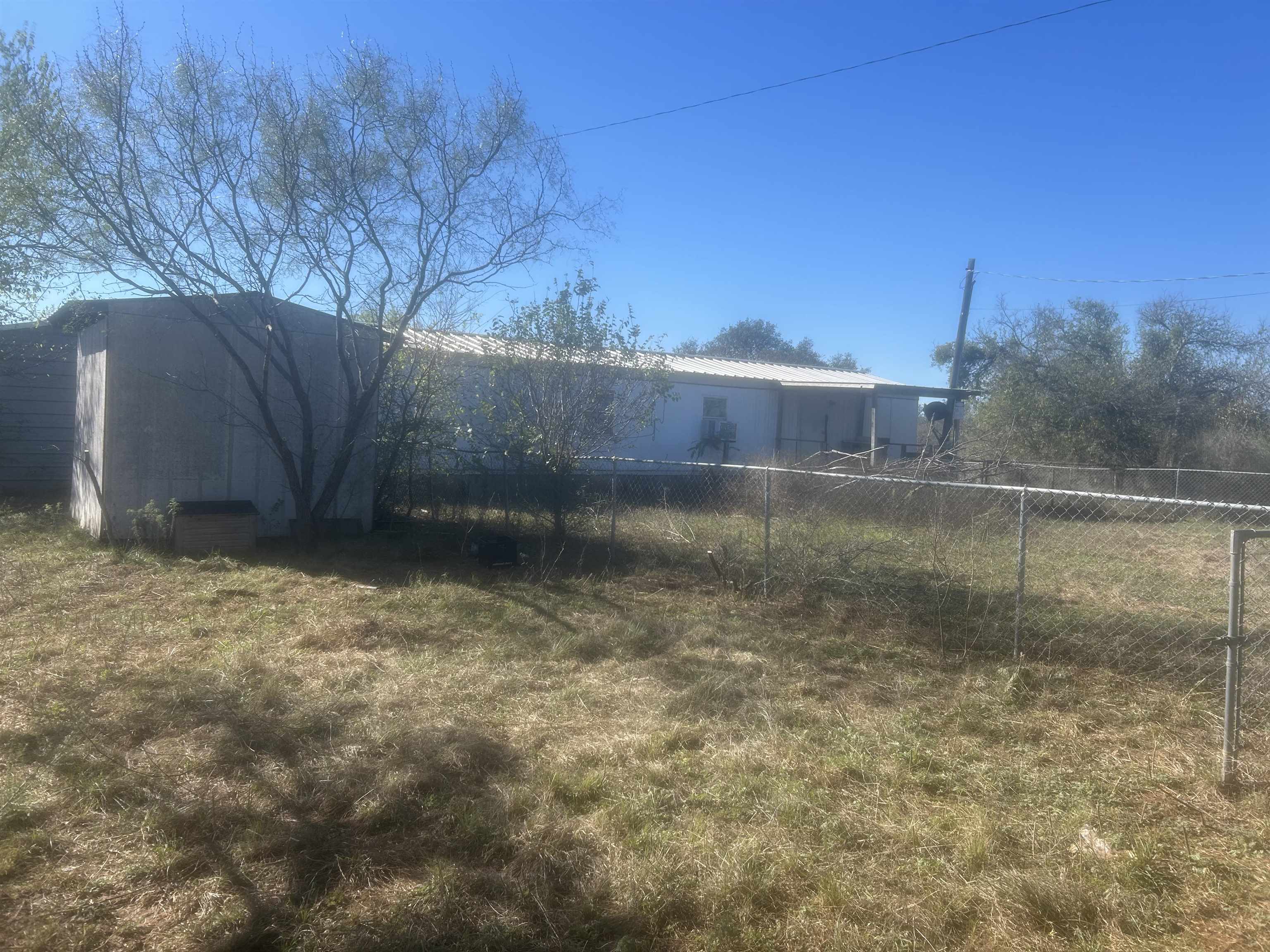 809 West Llano Street Llano, TX 78643 - Photo 6 of 12 a view of a backyard