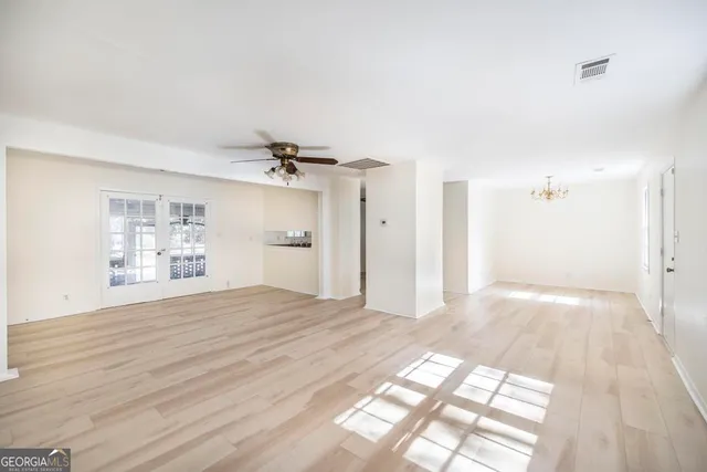 a kitchen with stainless steel appliances granite countertop a stove and a refrigerator
