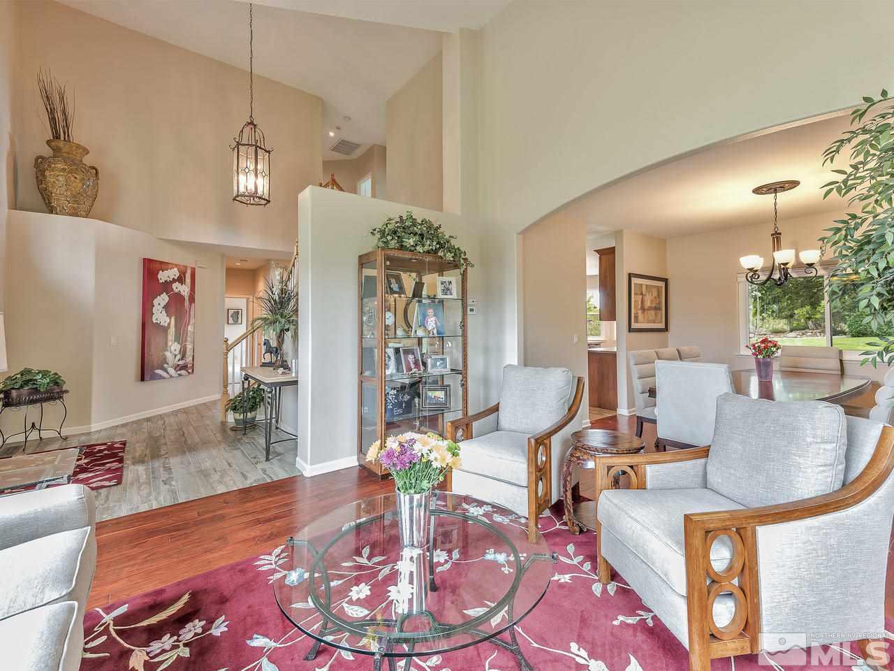 5070 West Albuquerque Road Reno, NV 89511 - Photo 6 of 25 a living room with furniture and wooden floor