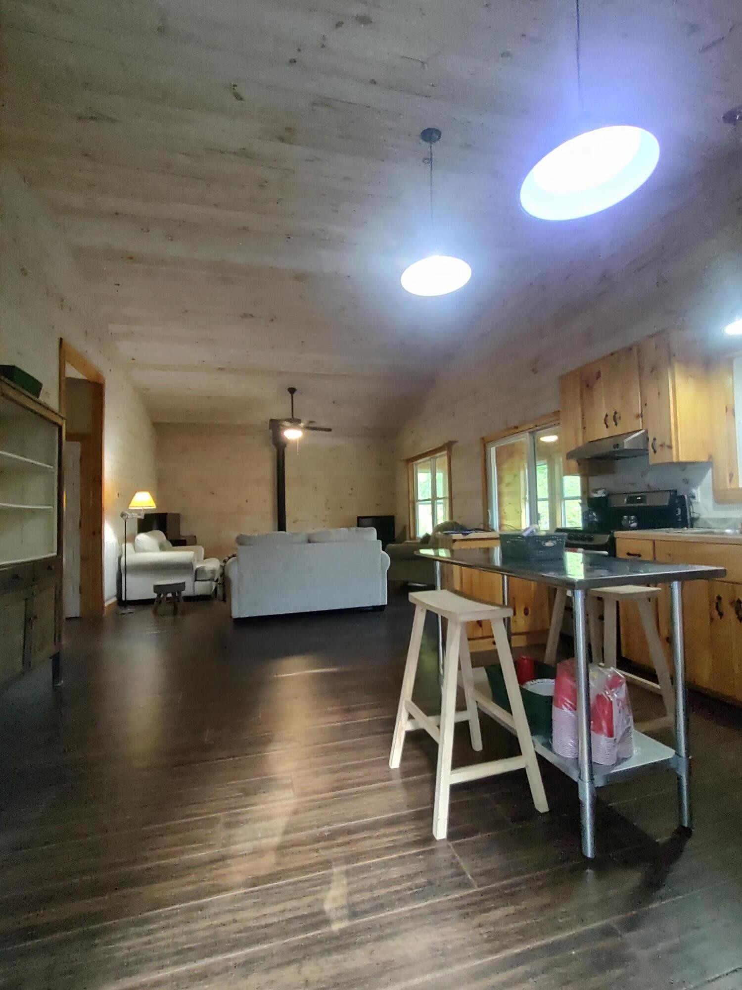 121 Polly Wally Road Ocoee, TN 37361 - Photo 11 of 29 a view of a room with wooden floor table and windows