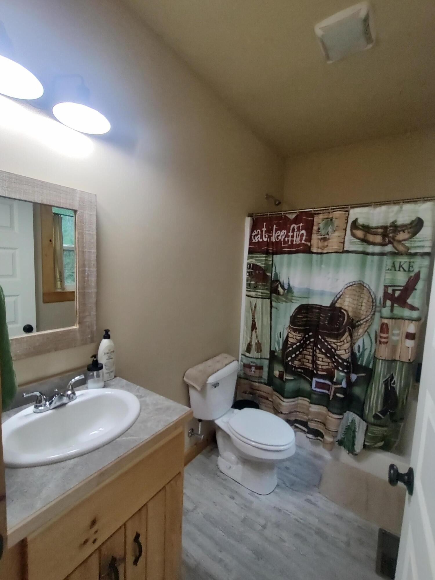 121 Polly Wally Road Ocoee, TN 37361 - Photo 18 of 29 a bathroom with a sink and mirror