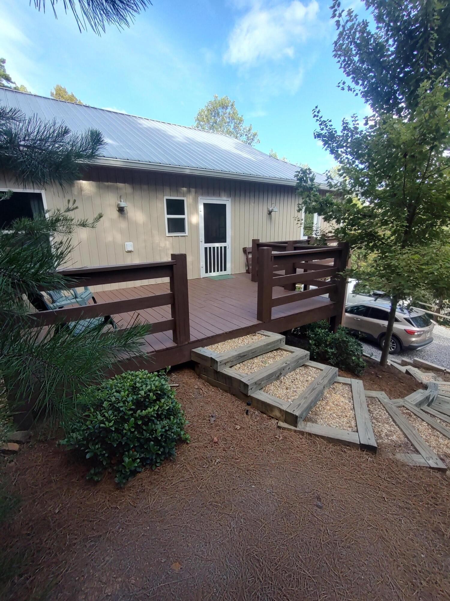 121 Polly Wally Road Ocoee, TN 37361 - Photo 3 of 29 a front view of a house with a garden