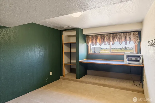a spacious bathroom with a bathtub and shower