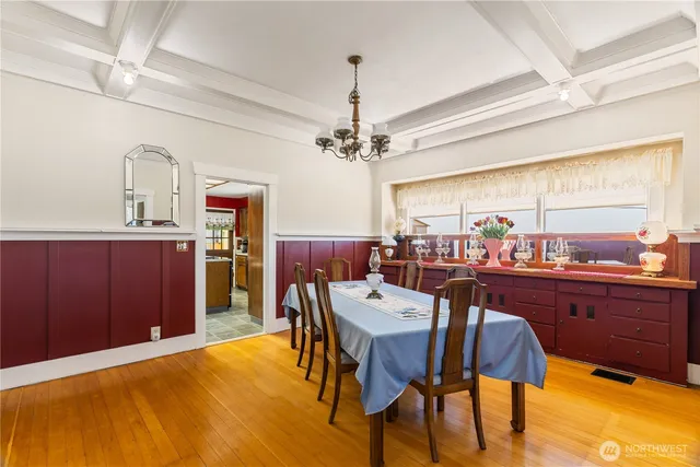 a view of a dining room with furniture and window