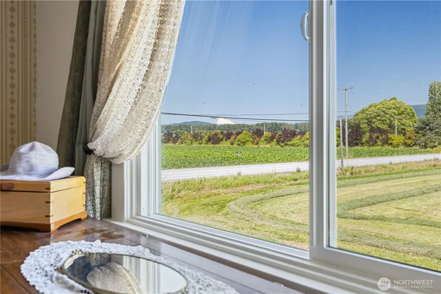 a bathroom with a sink and a large window