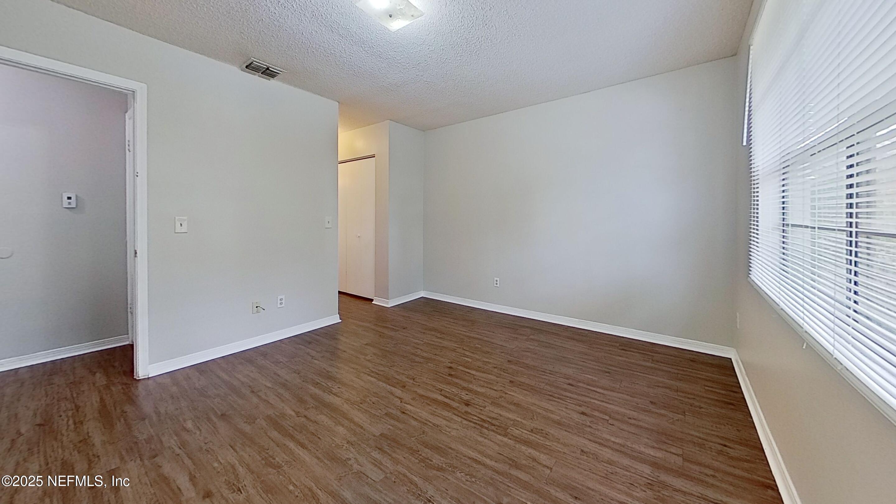 477 Crabapple Court, Unit C Orange Park, FL 32073 - Photo 7 of 13 wooden floor in an empty room