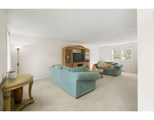 48 Rainbow Drive Haverhill, MA 01835 - Photo 11 of 33 a living room with furniture and a wooden floor