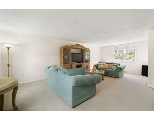 48 Rainbow Drive Haverhill, MA 01835 - Photo 13 of 33 a living room with furniture and a window