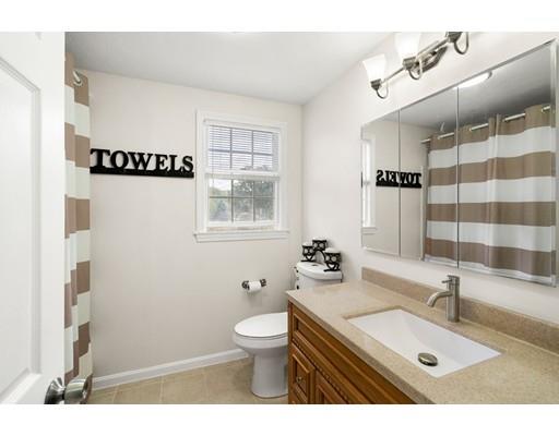 48 Rainbow Drive Haverhill, MA 01835 - Photo 14 of 33 a bathroom with a sink a toilet and a mirror