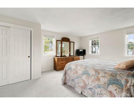 48 Rainbow Drive Haverhill, MA 01835 - Photo 17 of 33 a bedroom with a bed and a large mirror