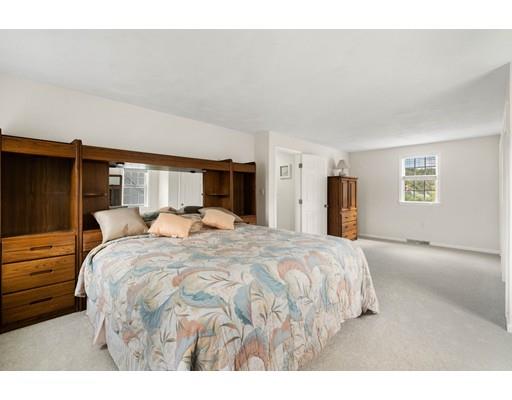 48 Rainbow Drive Haverhill, MA 01835 - Photo 19 of 33 a bedroom with a large bed and dresser