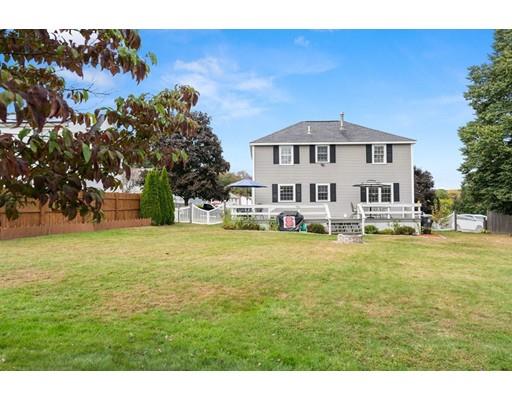 48 Rainbow Drive Haverhill, MA 01835 - Photo 2 of 33 a house with huge green field in front of it