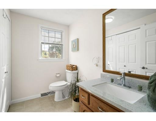 48 Rainbow Drive Haverhill, MA 01835 - Photo 25 of 33 a bathroom with a sink toilet and window