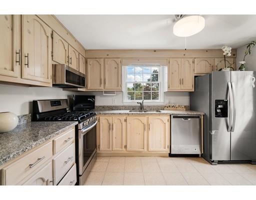 48 Rainbow Drive Haverhill, MA 01835 - Photo 5 of 33 a kitchen with stainless steel appliances granite countertop a refrigerator a stove a sink and a granite counter tops
