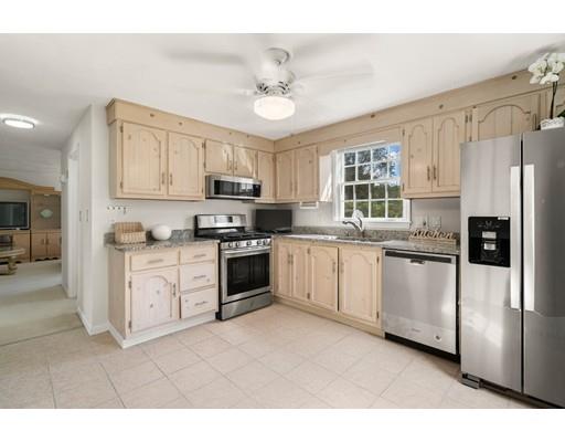 48 Rainbow Drive Haverhill, MA 01835 - Photo 6 of 33 a kitchen with white cabinets and white appliances