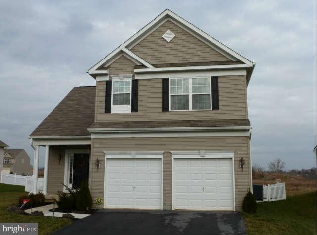 81 Glenbrook Road Ranson, WV 25438 - Photo 1 of 30 a front view of a house with a yard