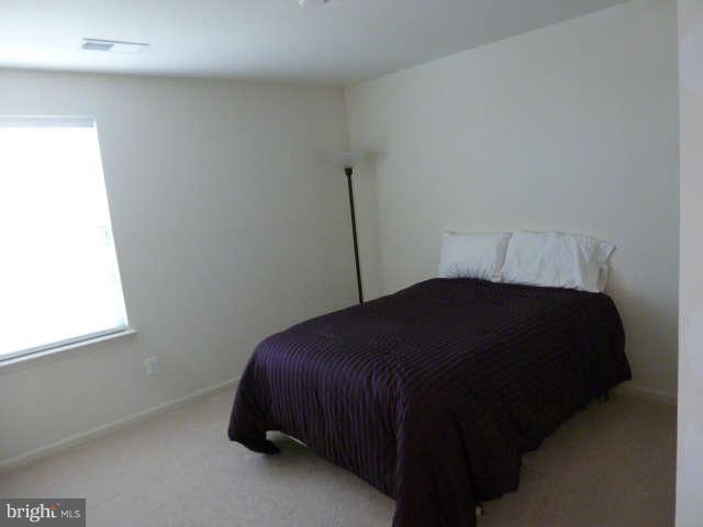 81 Glenbrook Road Ranson, WV 25438 - Photo 15 of 30 a bedroom with a bed and a window
