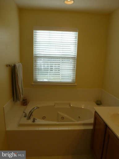 81 Glenbrook Road Ranson, WV 25438 - Photo 20 of 30 a bathroom with a bathtub and a window