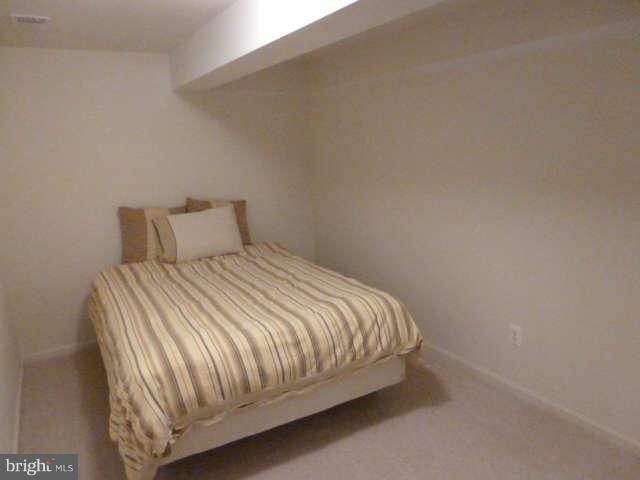 81 Glenbrook Road Ranson, WV 25438 - Photo 25 of 30 a bedroom with a bed and a wall painting