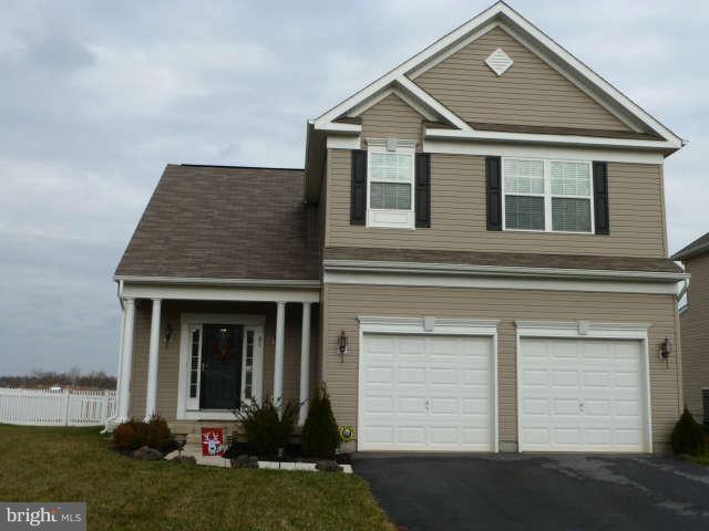 81 Glenbrook Road Ranson, WV 25438 - Photo 30 of 30 a front view of a house with a yard and garage