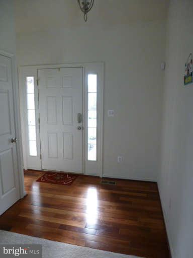 81 Glenbrook Road Ranson, WV 25438 - Photo 4 of 30 a view of room with window and wooden floor