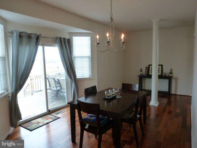 81 Glenbrook Road Ranson, WV 25438 - Photo 9 of 30 a view of a dining room with furniture window and wooden floor