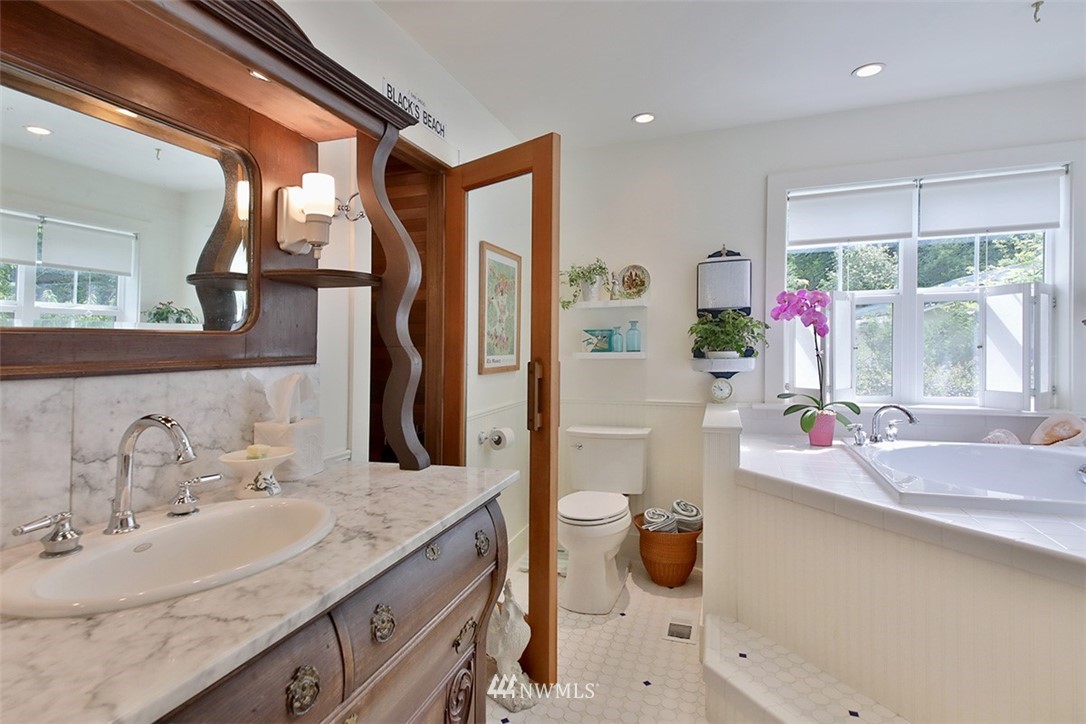 1618 & 1616 Lancaster Road Freeland, WA 98249 - Photo 14 of 40 a bathroom with a sink double vanity and a mirror