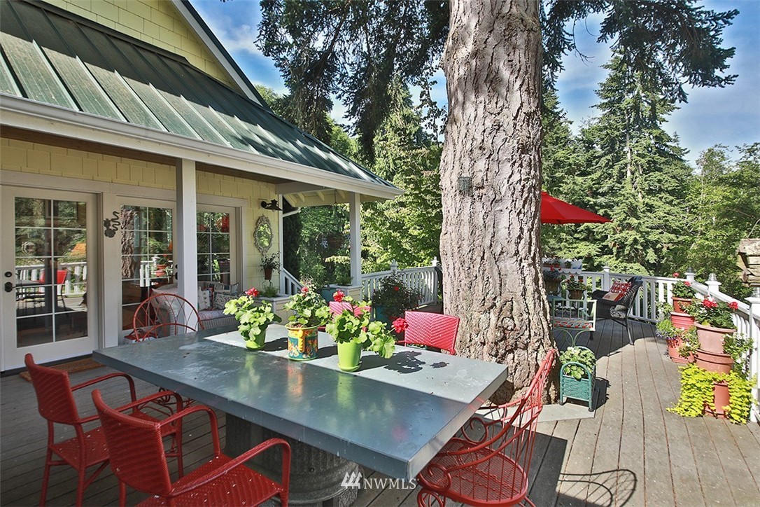 1618 & 1616 Lancaster Road Freeland, WA 98249 - Photo 20 of 40 a outdoor living space with furniture and flowers