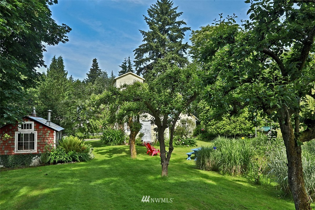 1618 & 1616 Lancaster Road Freeland, WA 98249 - Photo 24 of 40 a view of an house with a yard