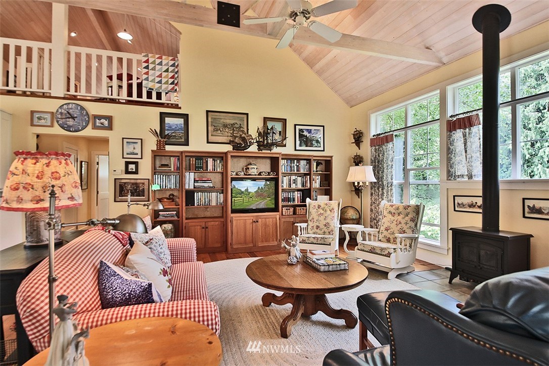 1618 & 1616 Lancaster Road Freeland, WA 98249 - Photo 9 of 40 a living room with furniture a table and a large window