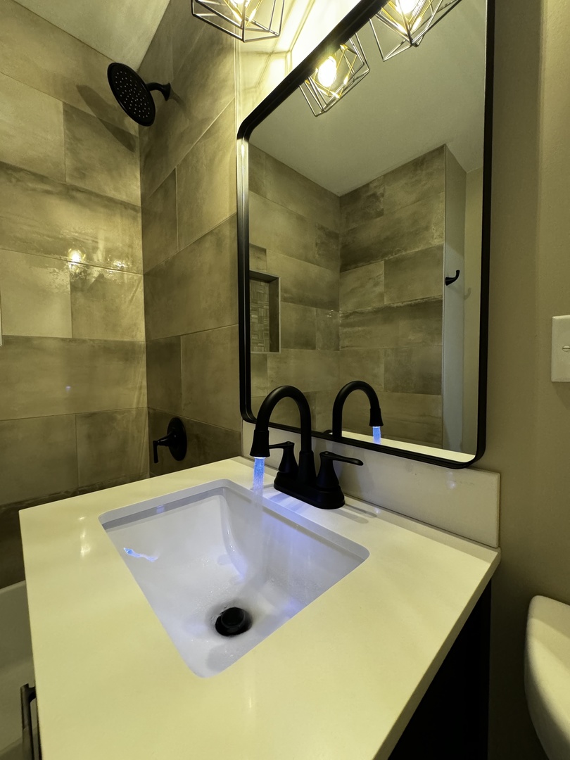 3302 St James Street Rolling Meadows, IL 60008 - Photo 12 of 20 a bathroom with a sink and a mirror