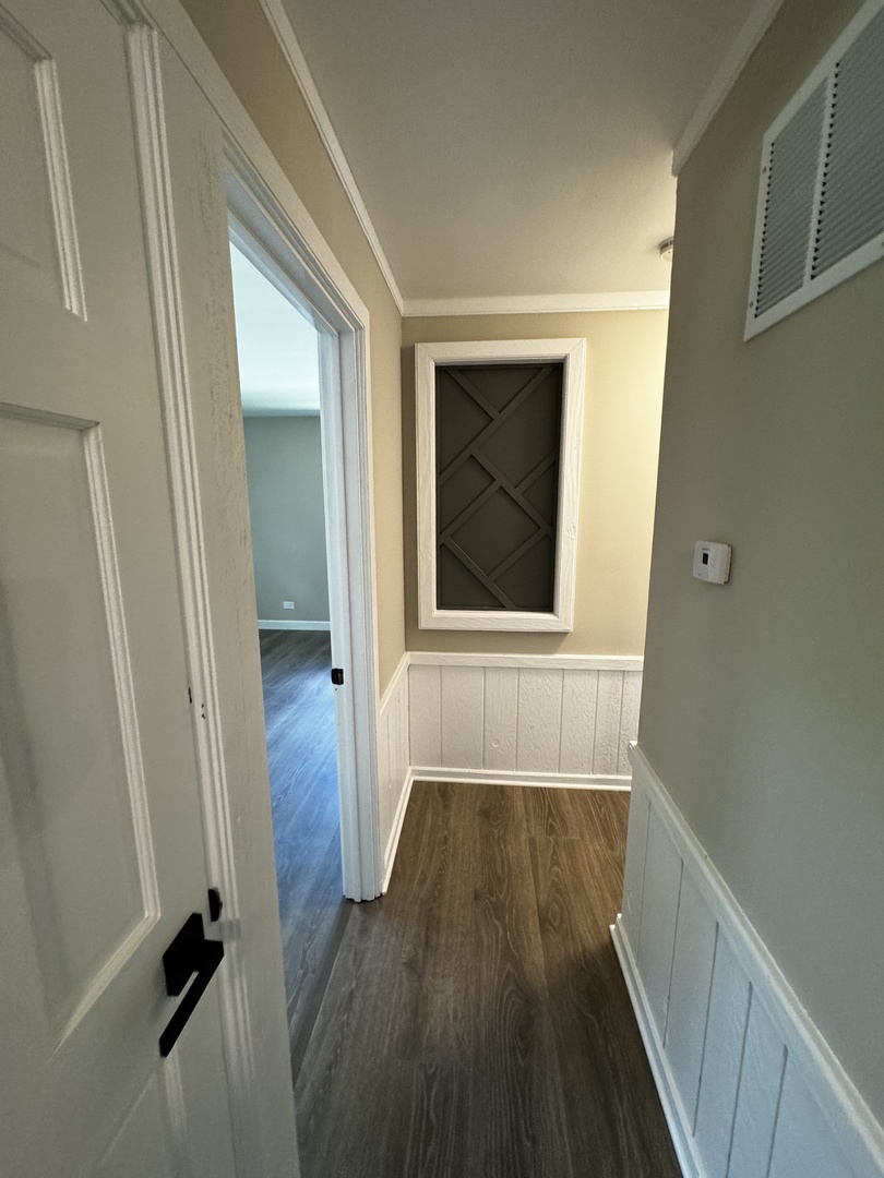 3302 St James Street Rolling Meadows, IL 60008 - Photo 14 of 20 a view of a room with wooden floor and a window