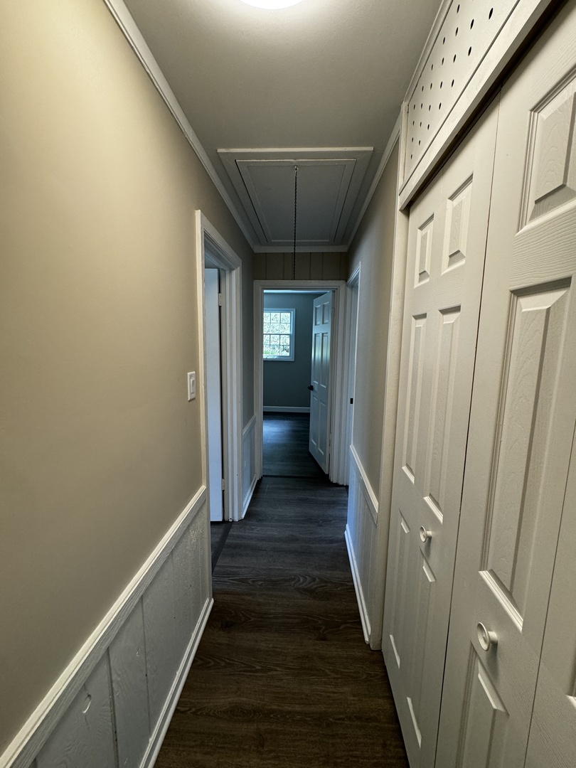 3302 St James Street Rolling Meadows, IL 60008 - Photo 16 of 20 a view of a hallway with wooden floor and staircase