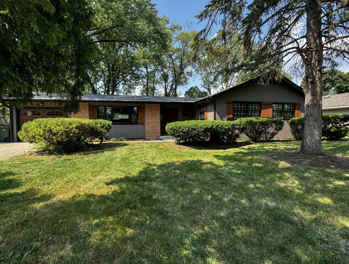 3302 St James Street Rolling Meadows, IL 60008 - Photo 20 of 20 a front view of a house with a garden