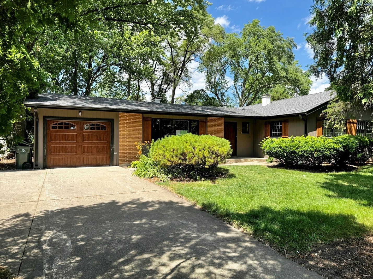 3302 St James Street Rolling Meadows, IL 60008 - Photo 2 of 20 a front view of a house with garden