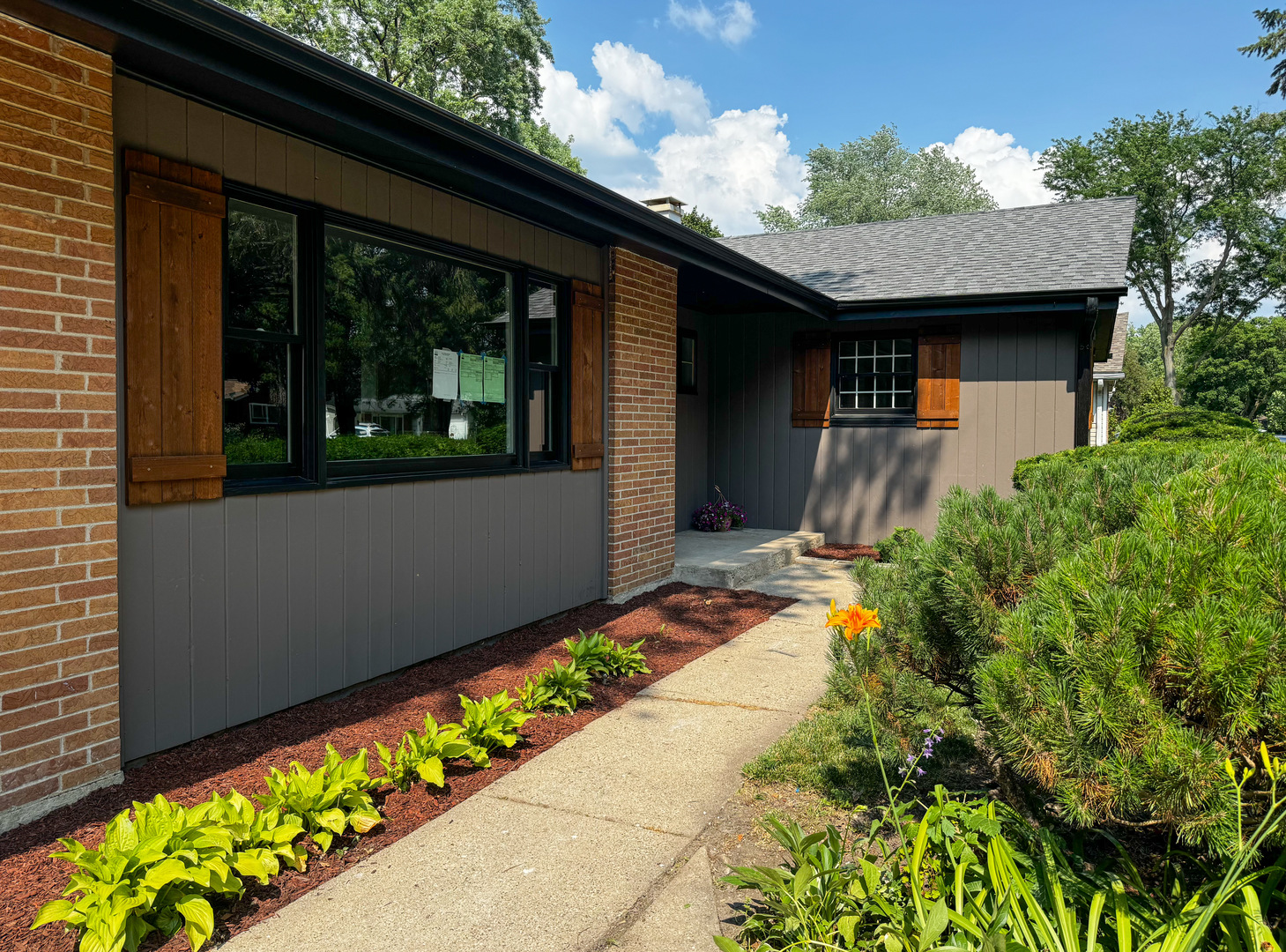 3302 St James Street Rolling Meadows, IL 60008 - Photo 3 of 20 a front view of a house with a yard
