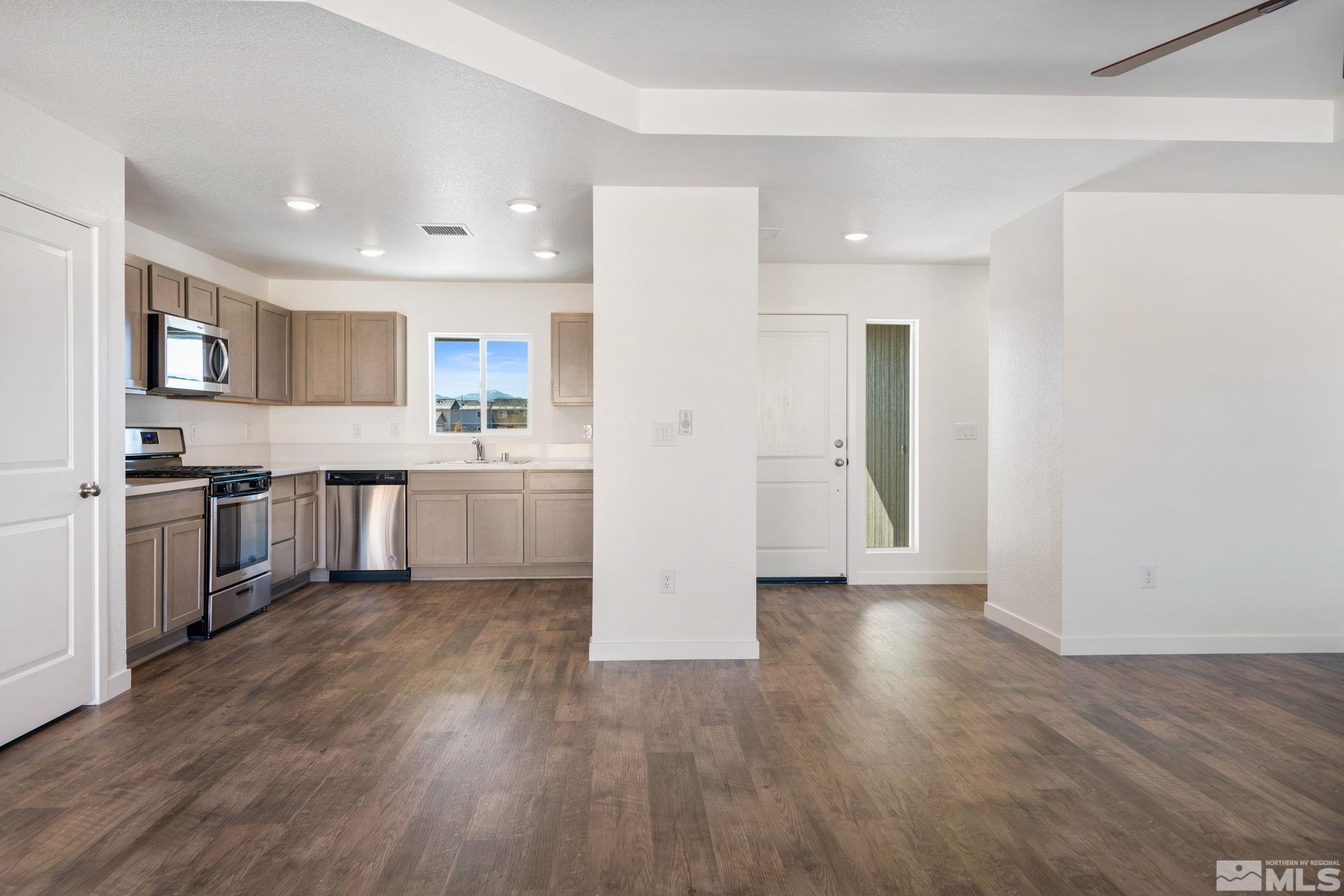 211 Green Lane Dayton, NV 89403 - Photo 13 of 28 a view of kitchen with wooden floor and electronic appliances