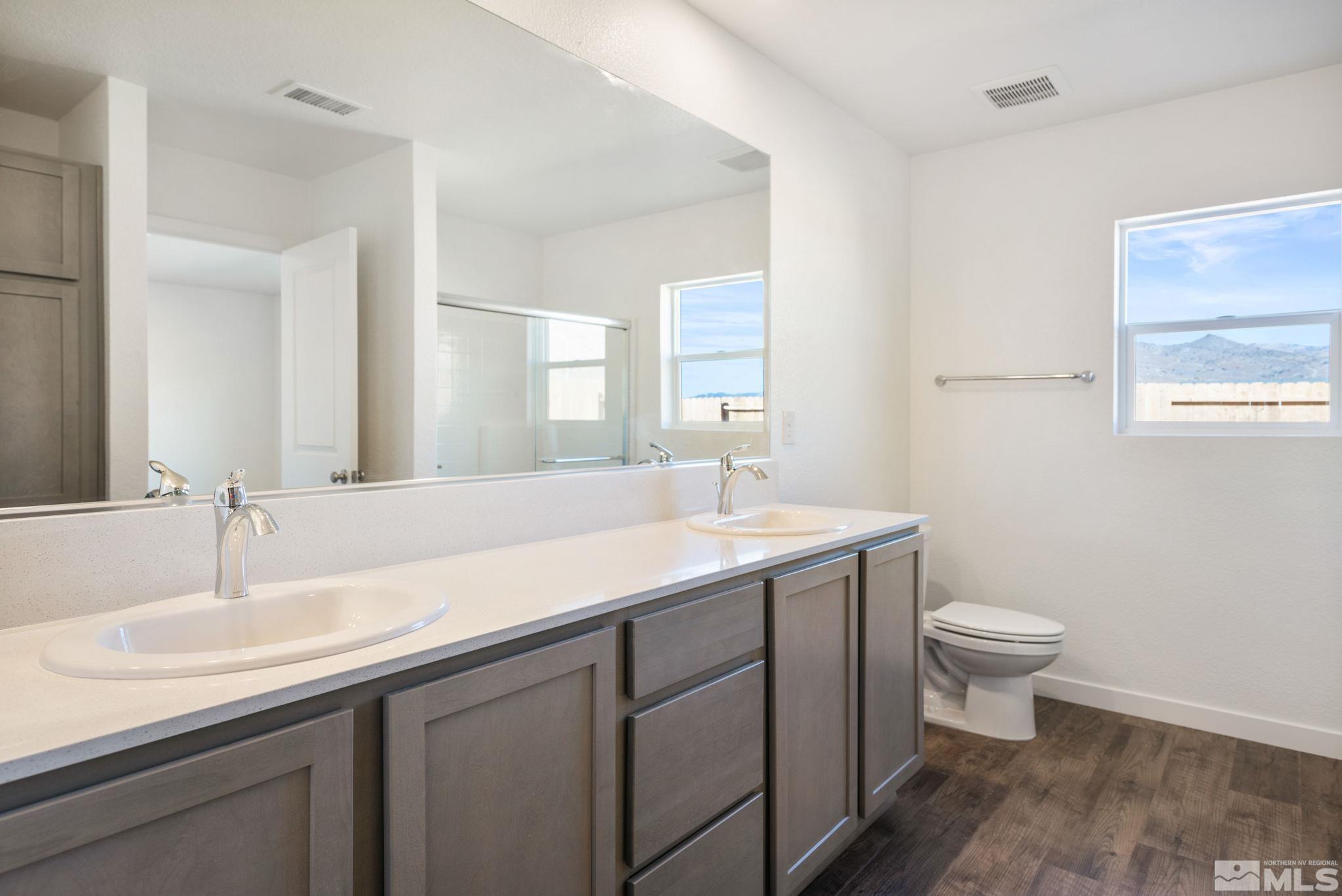 211 Green Lane Dayton, NV 89403 - Photo 18 of 28 a bathroom with a sink and a toilet