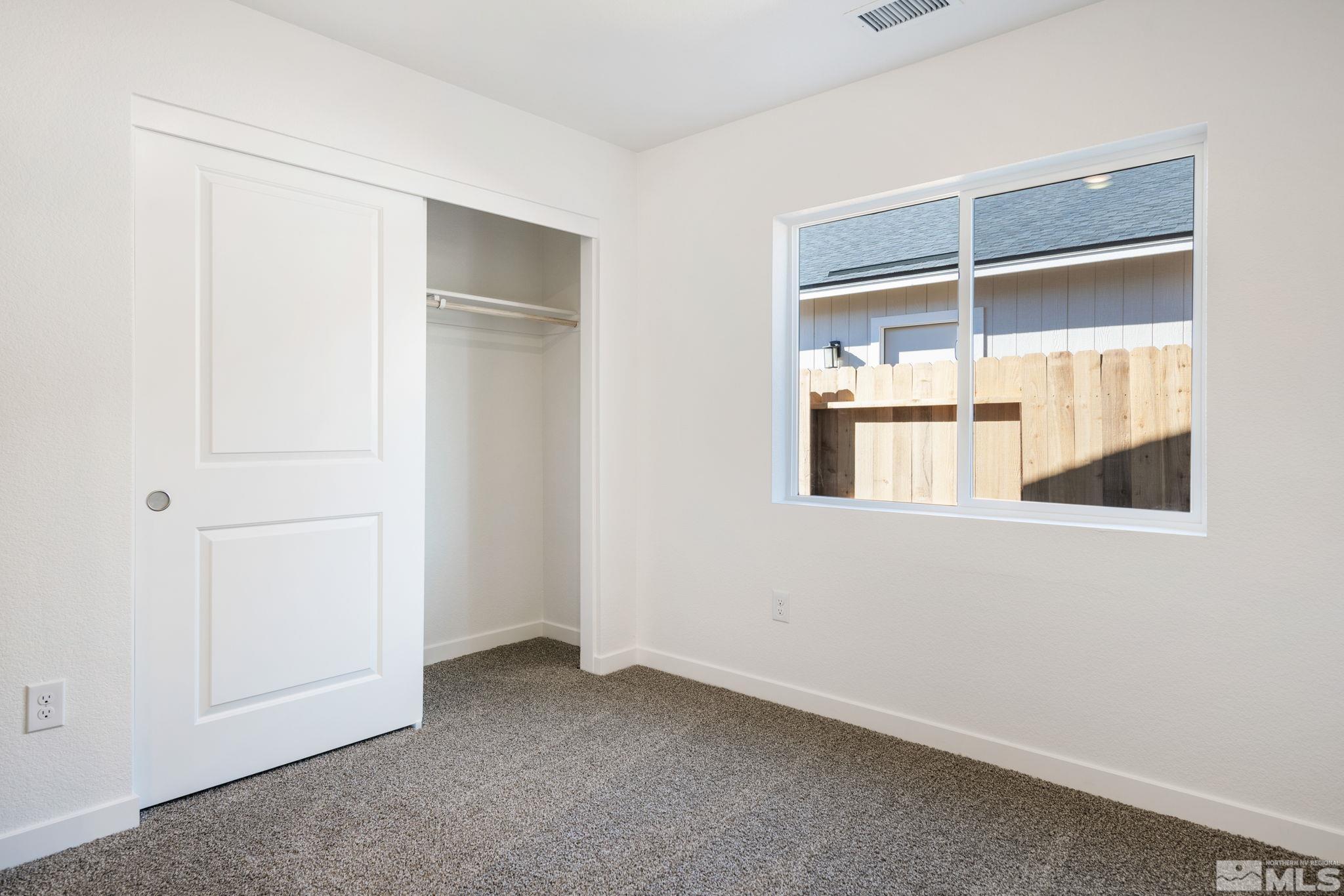 211 Green Lane Dayton, NV 89403 - Photo 20 of 28 a view of an empty room with a window