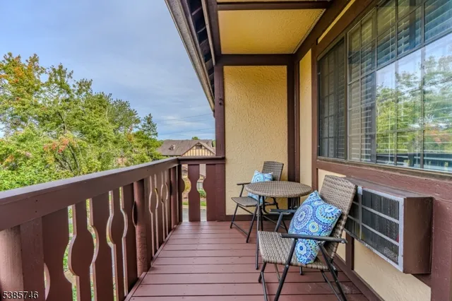 a view of a balcony with chairs