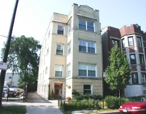 653 West Cornelia Avenue, Unit G Chicago, IL 60657 - Photo 1 of 1 a front view of a multi story residential apartment building with yard