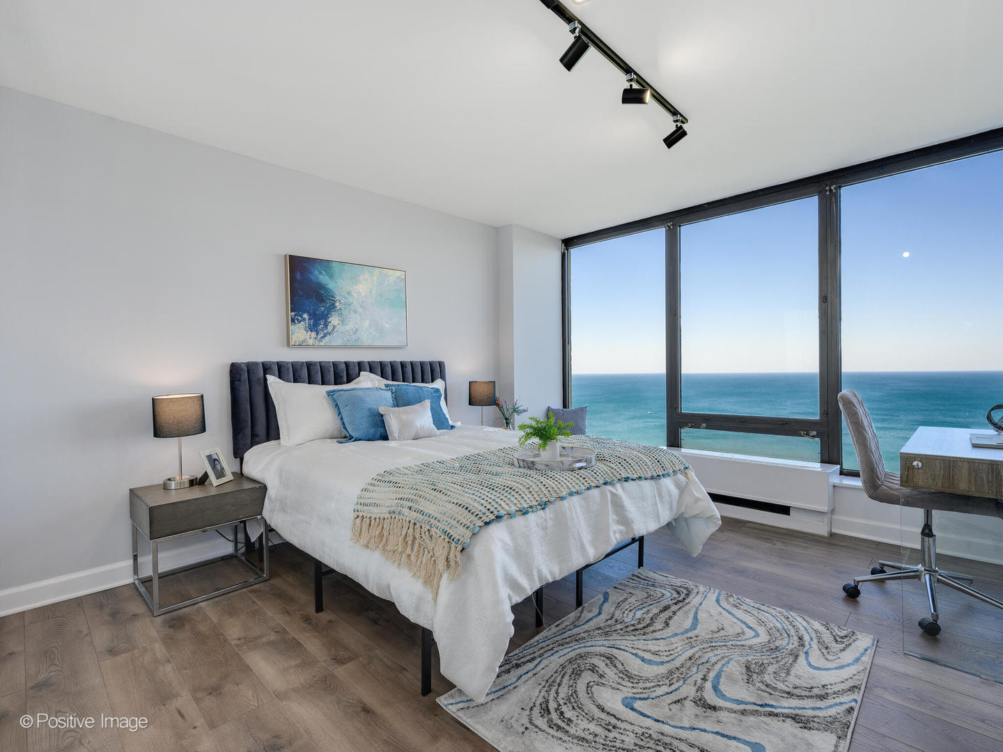 5445 North Sheridan Road, Unit 3404 Chicago, IL 60640 - Photo 13 of 24 a spacious bedroom with a bed and large window